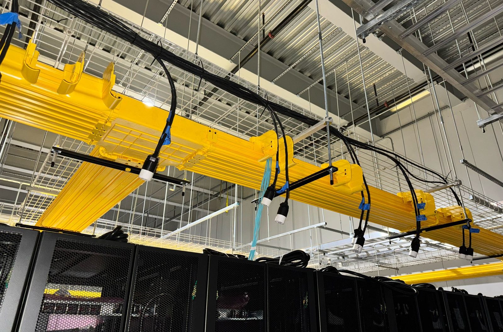 Fiber raceway and power drops over the server racks