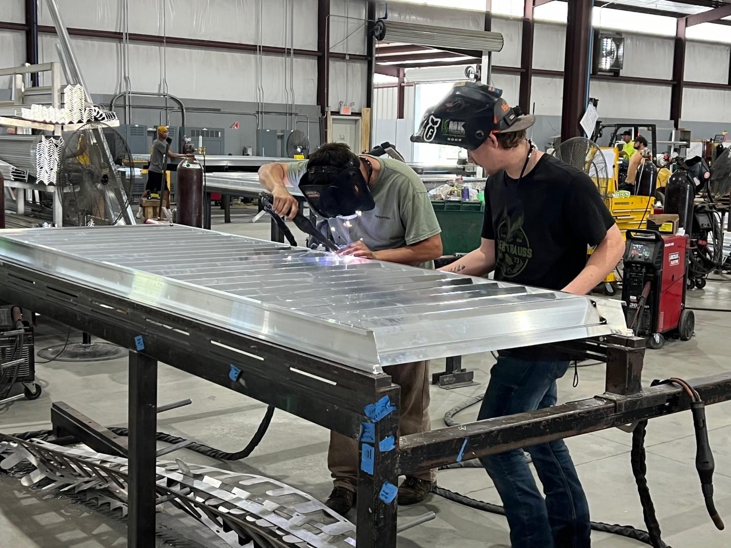 Welding louver blades into the frame