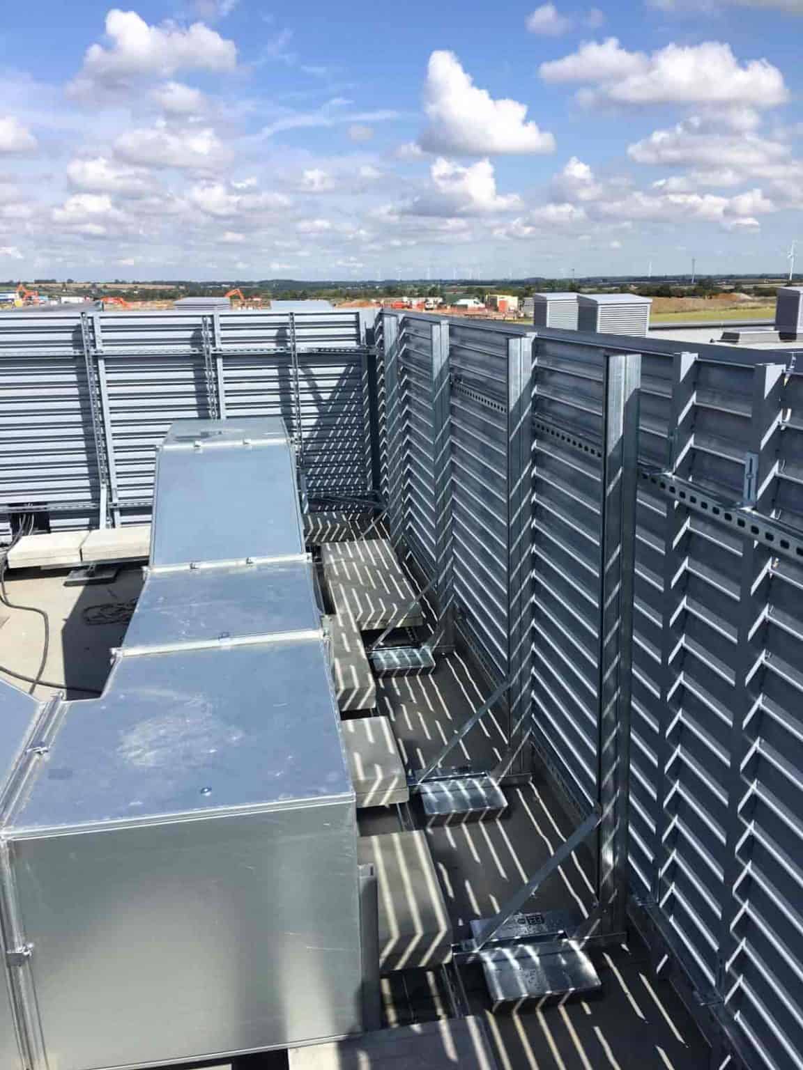Mega louver screen wall on the roof, around the ductwork