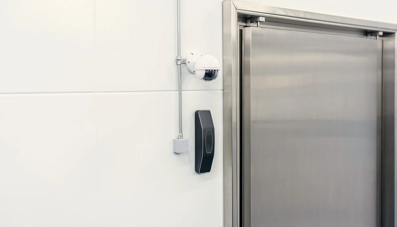 Card reader and dome camera at a controlled door
