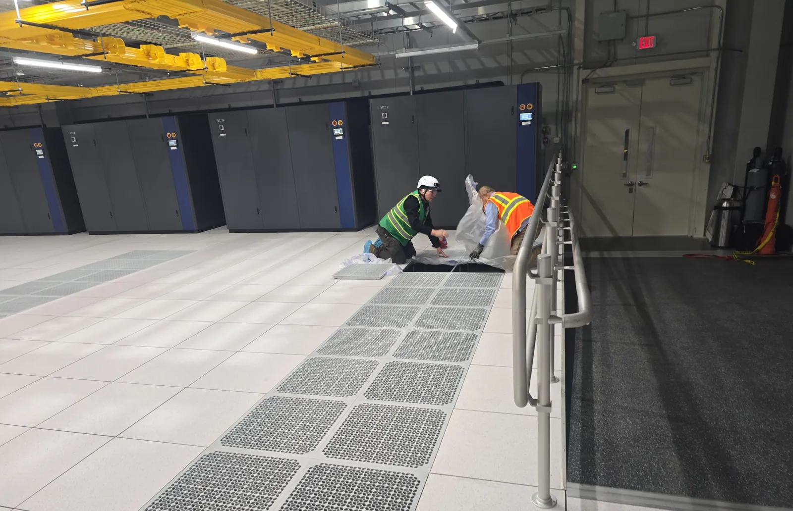 Raised access floor room with overhead bus duct