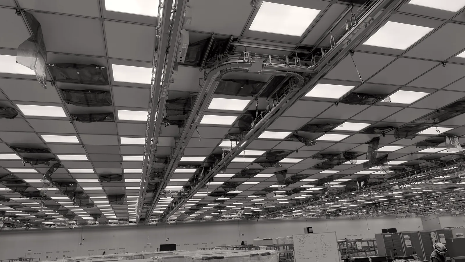 Sealed lighting and rails in a fab ceiling grid